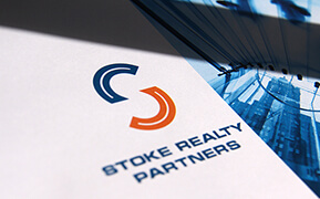 Stoke Realty Partners. Logo Design. Graphic Design. Presentation Folder Development.